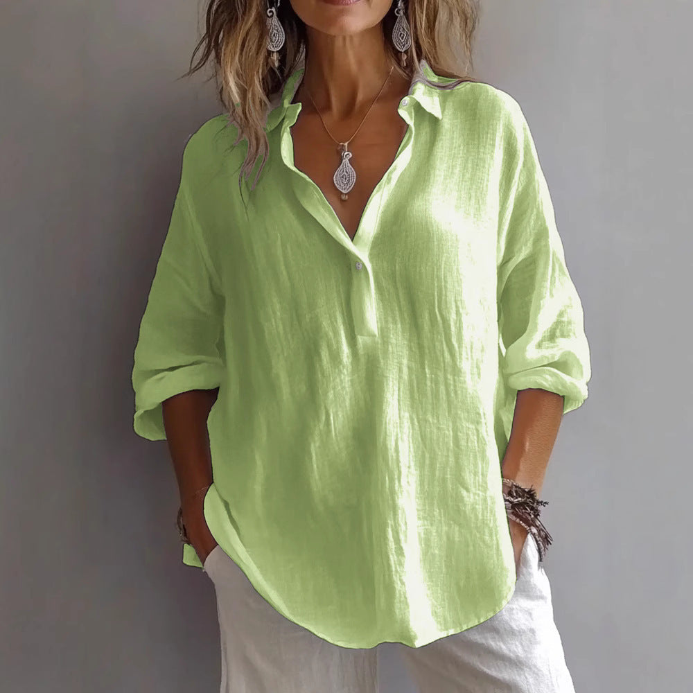 Fashionable women's button shirt, relaxed fit, wide sleeves. Versatile casual top for summer comfort and style.