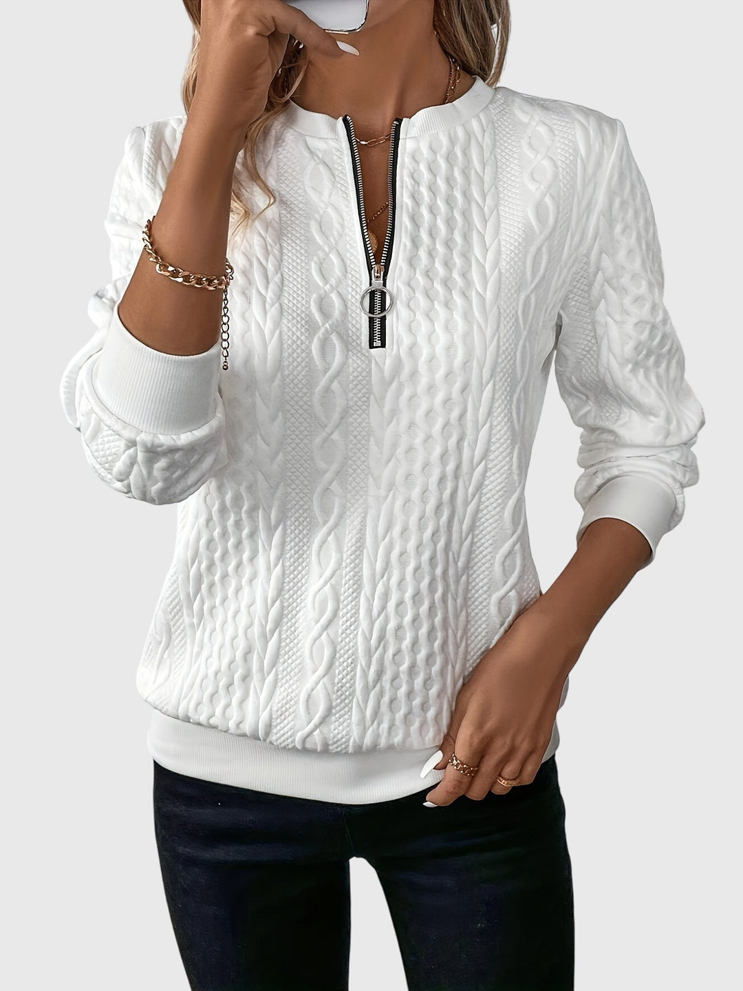 Women's cable knit quarter-zip pullover sweater, cozy fall fashion for versatile wear.