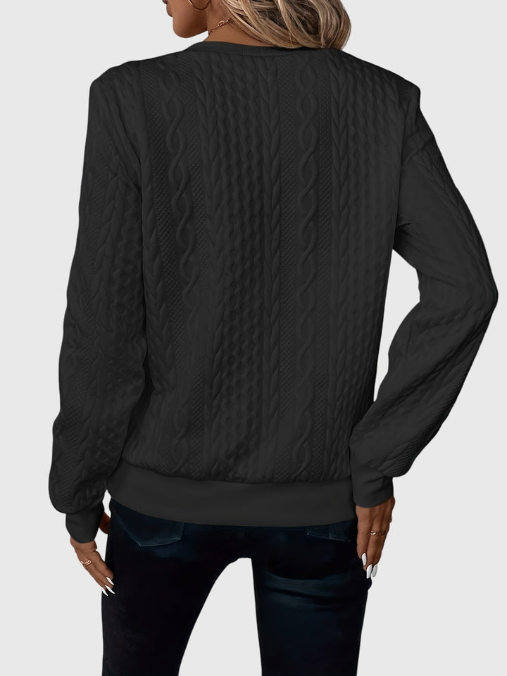 Premium women's cable knit quarter-zip pullover, offering luxurious feel & warm long sleeves.