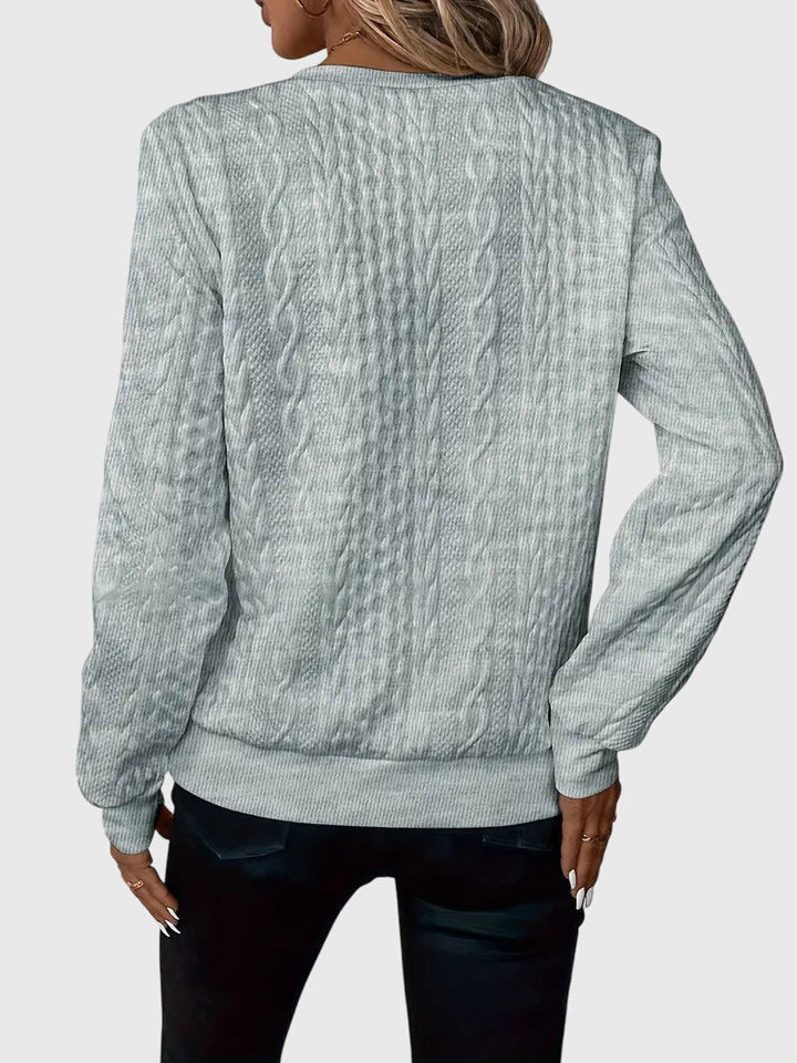Smart casual women's cable knit quarter-zip pullover, perfect for work or weekend style.