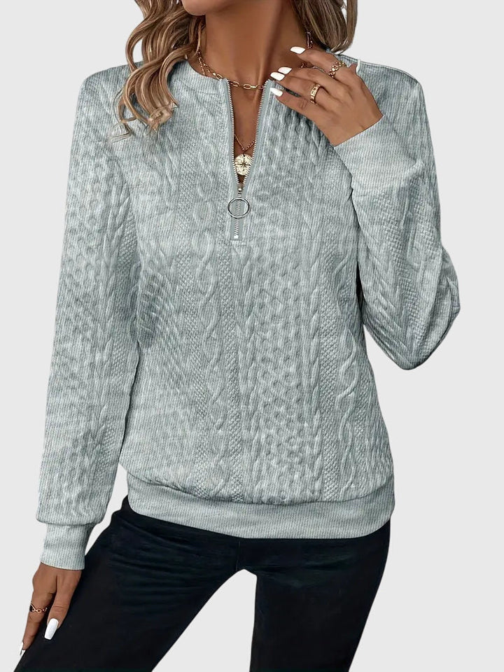 Beautifully textured women's cable knit quarter-zip pullover, for stylish fall ensembles.