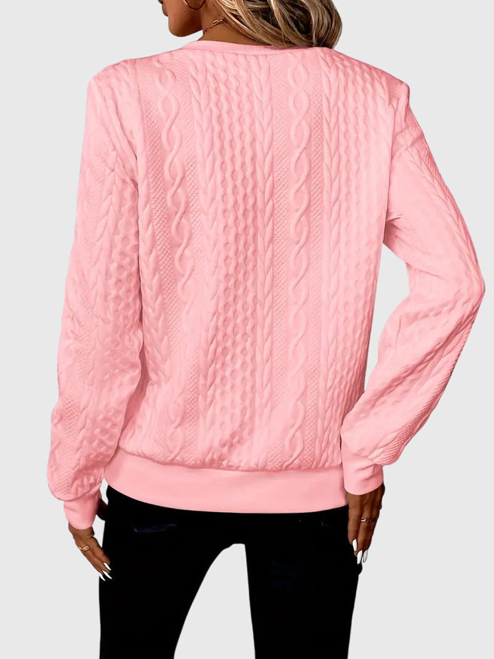 Soft women's cable knit quarter-zip pullover, designed for maximum comfort & style.