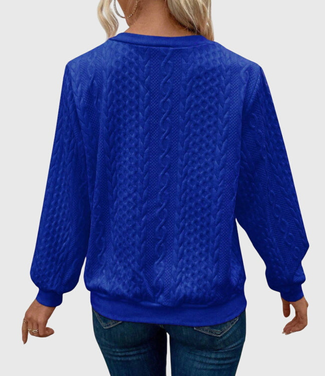 Versatile long sleeve women's cable knit quarter-zip sweater for layering & warmth.