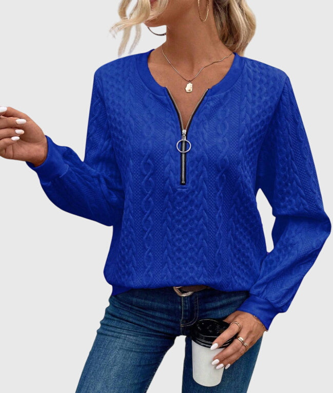 Stylish women's pullover with cable knit texture & quarter-zip, perfect for cozy winter wear.