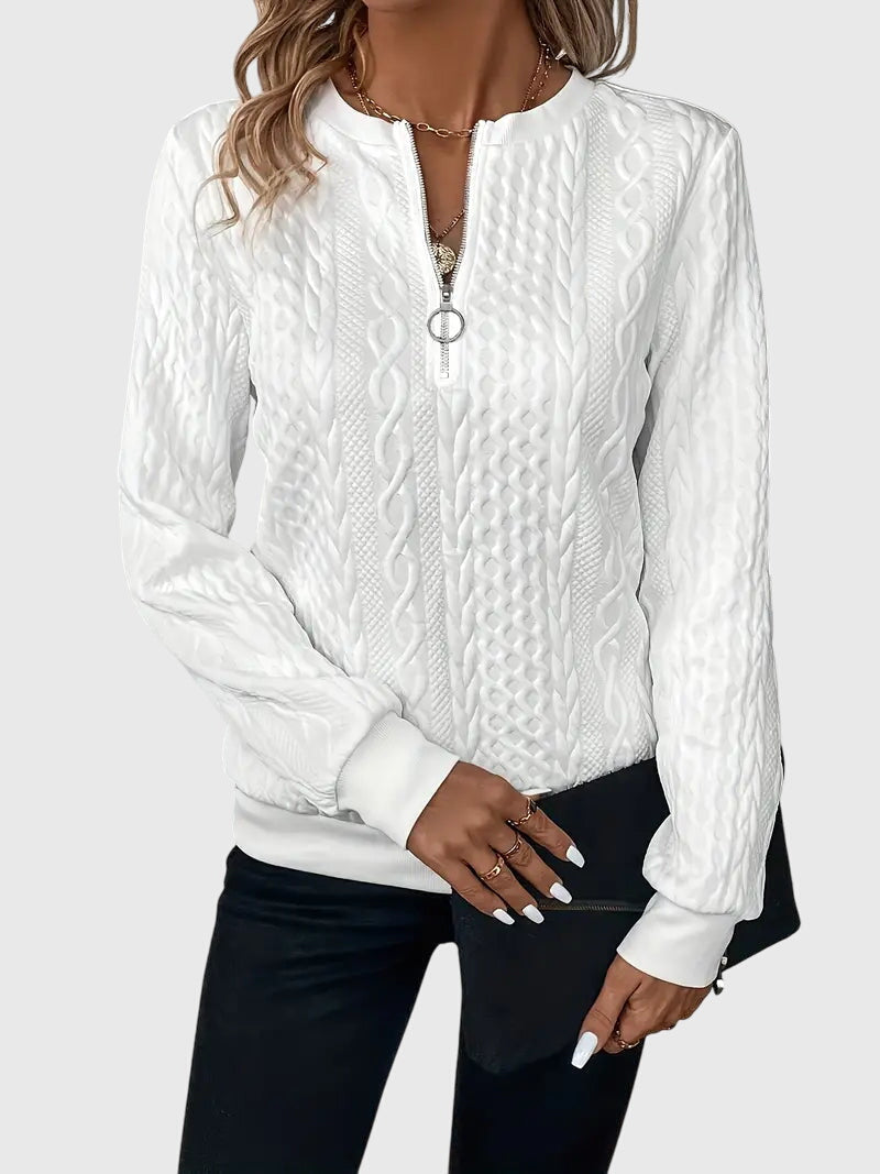 Versatile women's cable knit pullover with quarter-zip, essential for cozy everyday fashion.