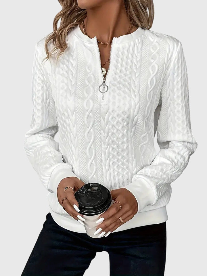 Long sleeve women's cable knit quarter-zip sweater, warm and stylish for cool weather.