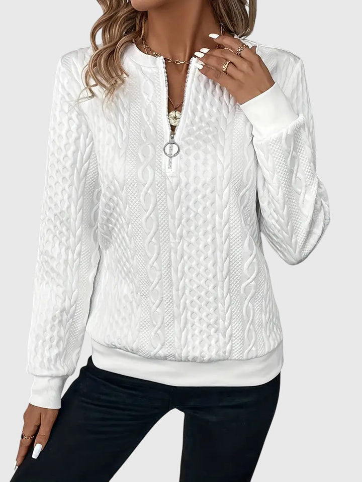 Textured women's cable knit quarter-zip pullover, a chic addition to fall & winter wardrobe.