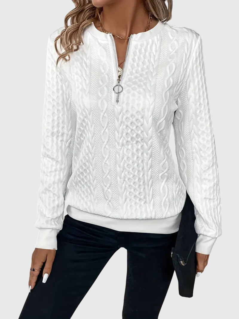 Cozy women's cable knit quarter-zip sweater, ideal for casual and comfortable knitwear style.