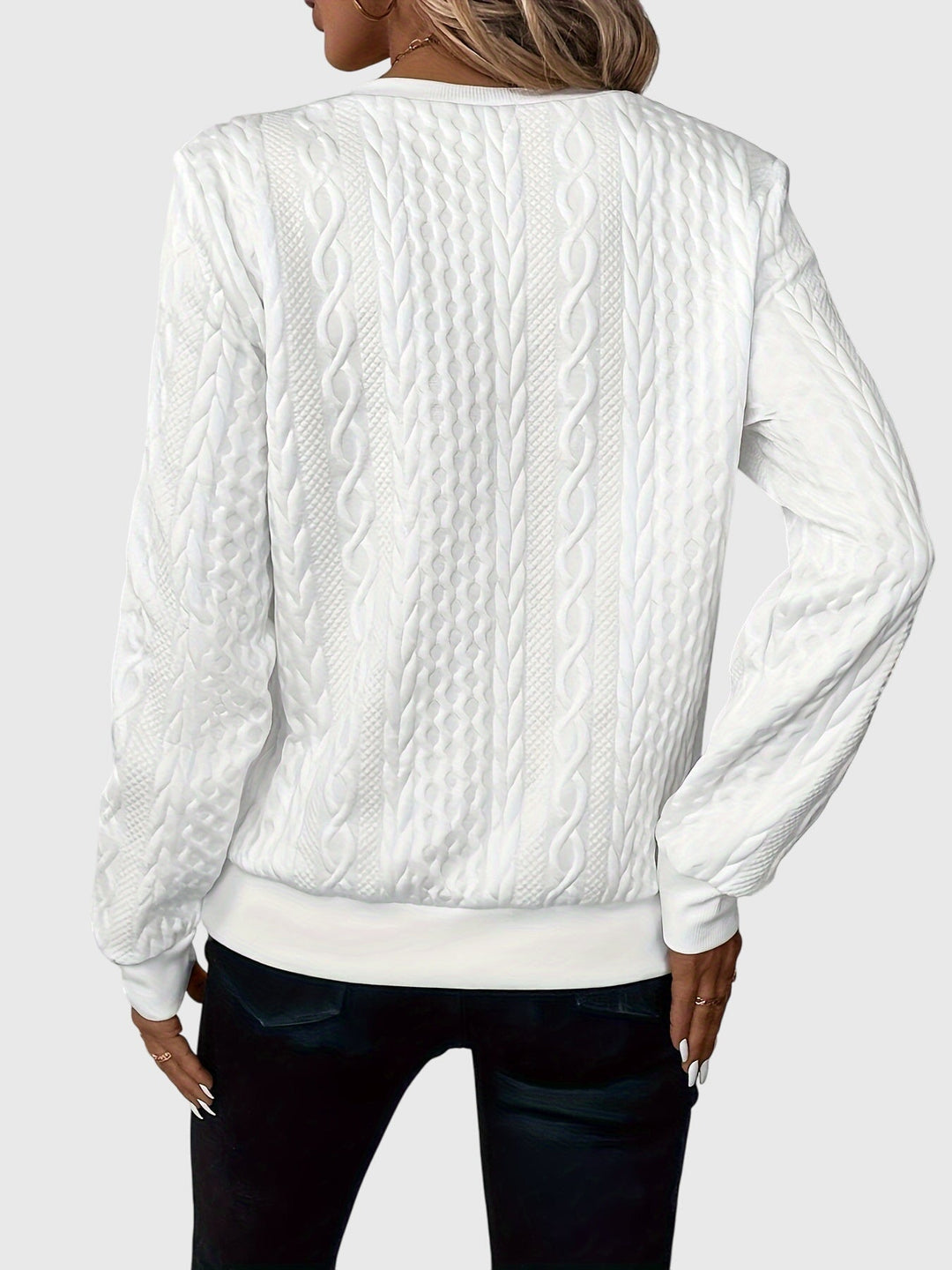 Women's cable knit quarter-zip pullover, a stylish and warm long sleeve for cooler seasons.