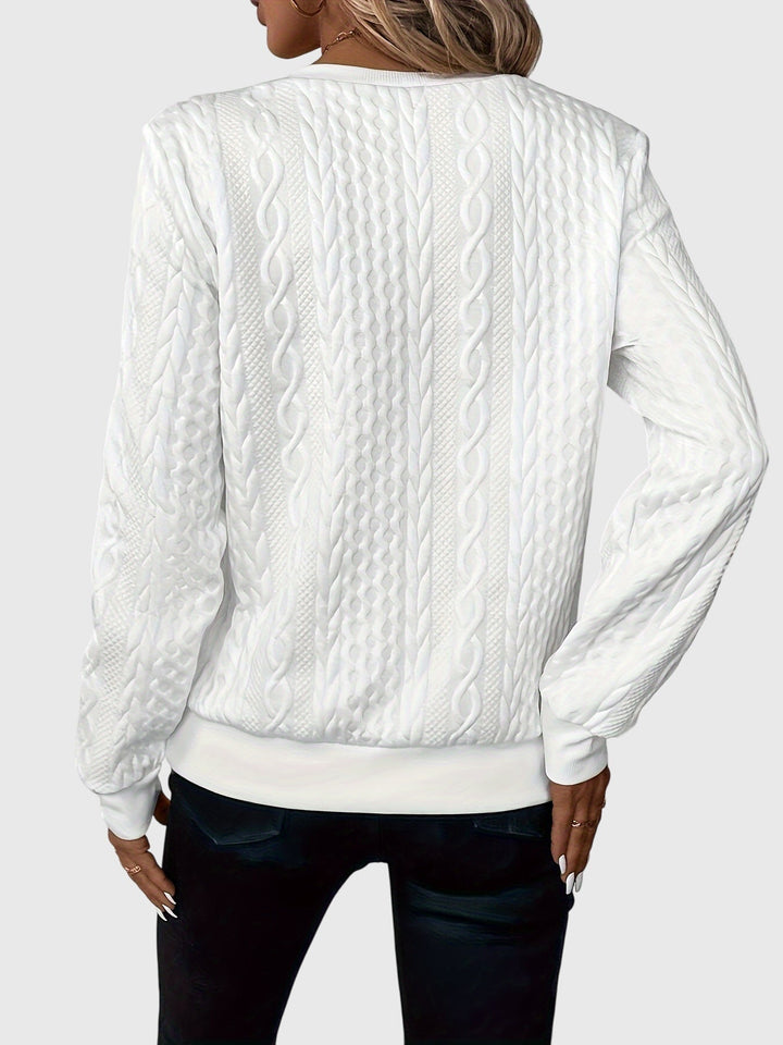 Women's cable knit quarter-zip pullover, a stylish and warm long sleeve for cooler seasons.
