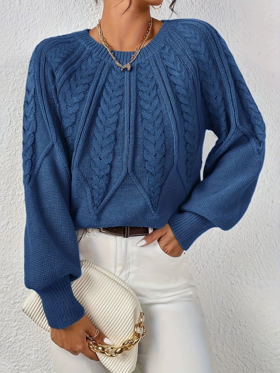 Versatile women's cable knit sweater, relaxed fit, with classic cable pattern & lantern sleeves.