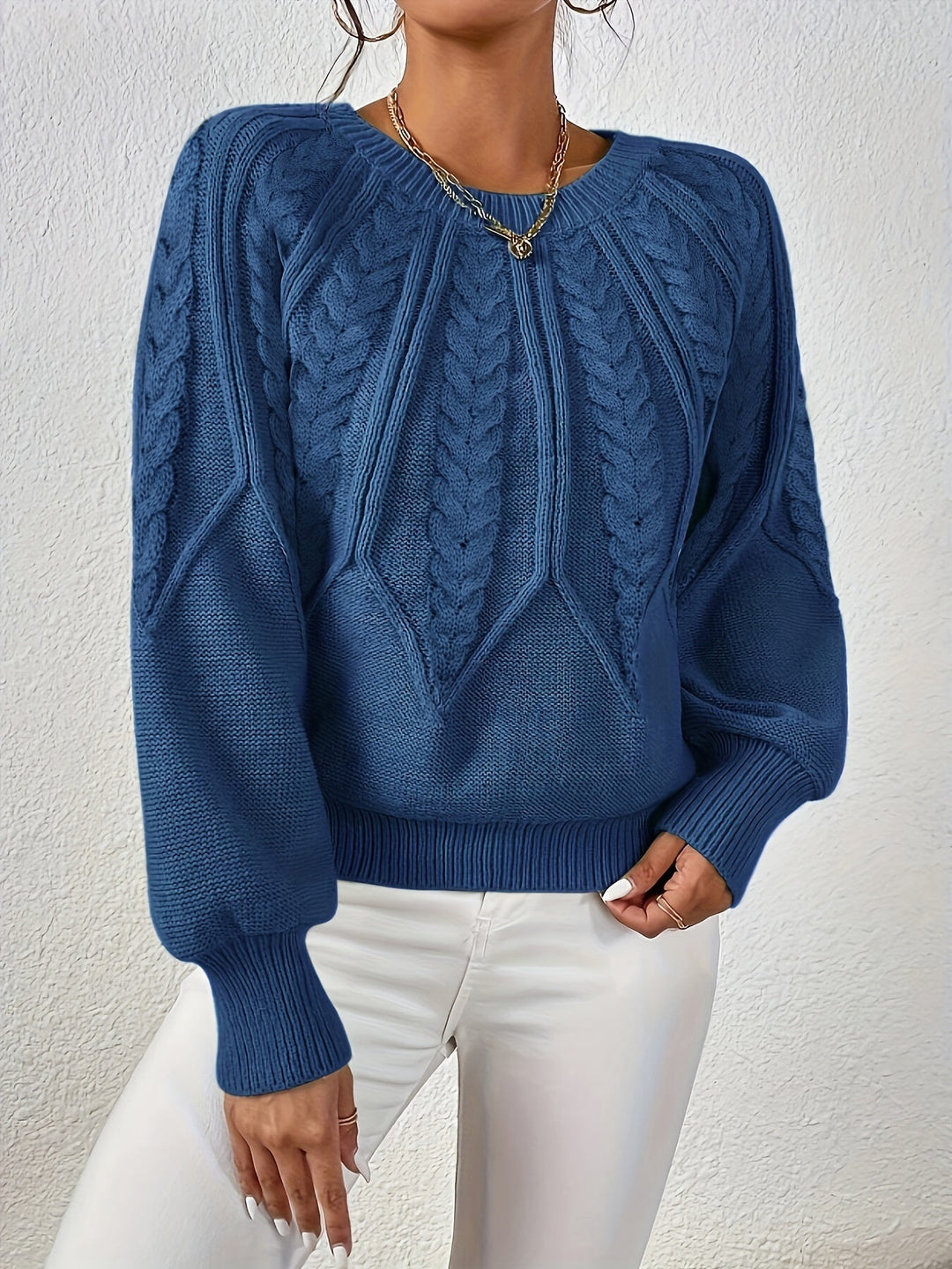 Casual women's cable knit sweater, relaxed fit, long lantern sleeves for everyday style.