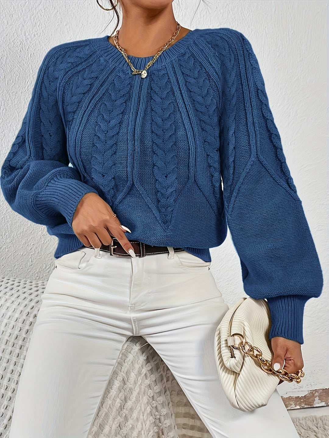 Women's everyday wear cable knit sweater, relaxed fit, charming lantern sleeves.