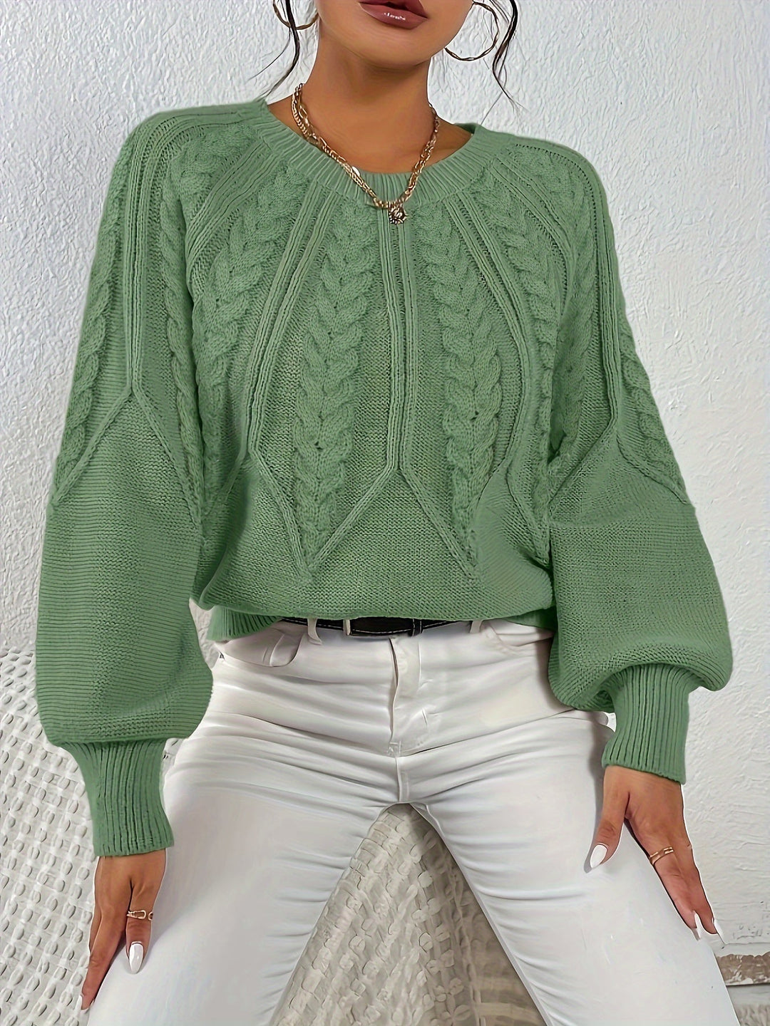 Cozy women's relaxed fit cable knit sweater, elegant lantern sleeves, perfect for casual wear.