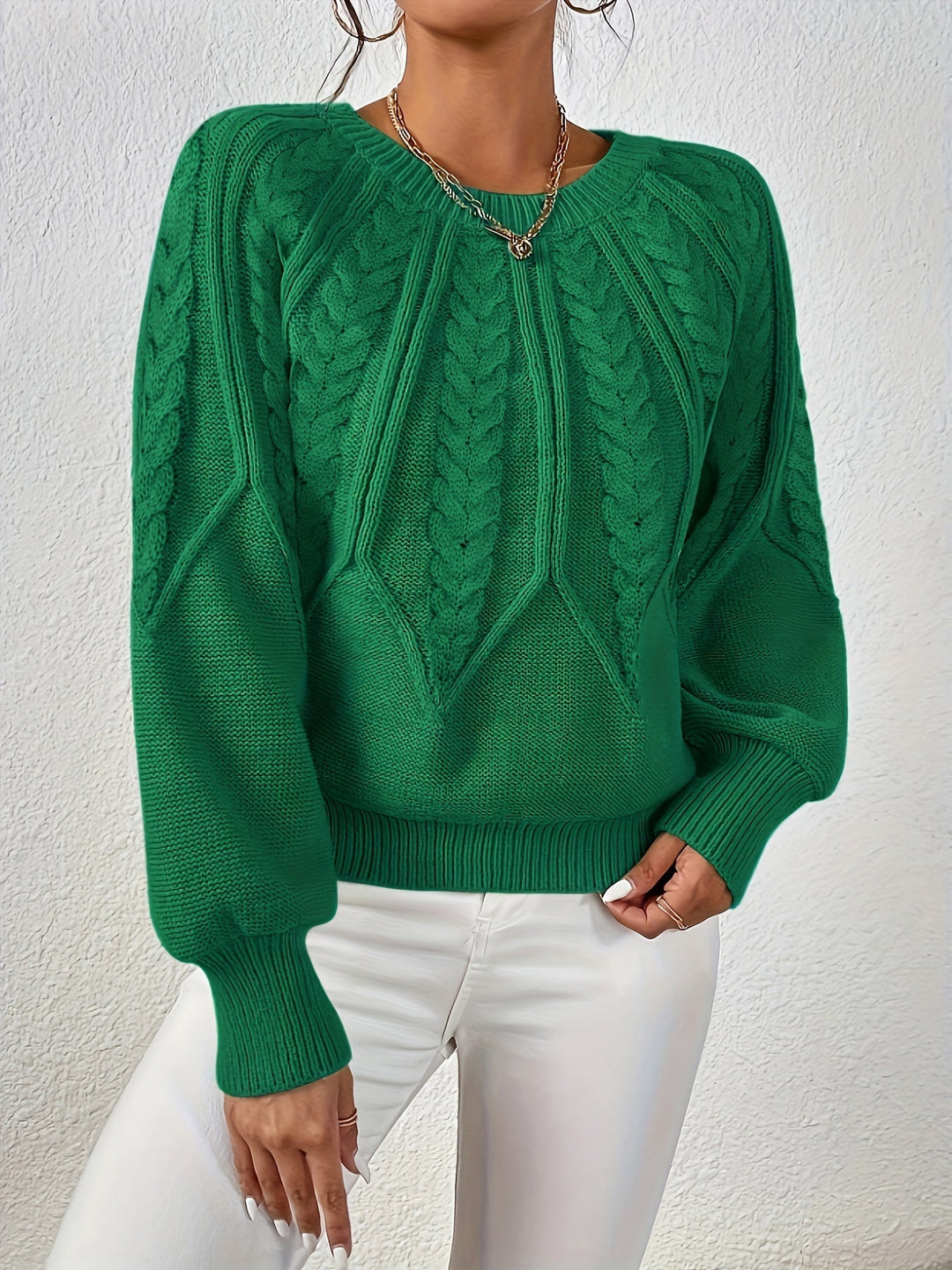 Fashion-forward women's cable knit sweater, relaxed fit, bold lantern sleeves.