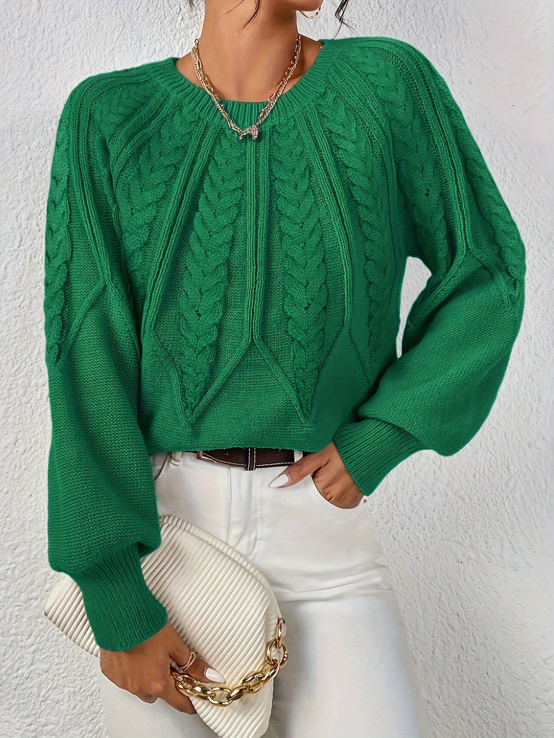 Sophisticated women's cable knit sweater, relaxed fit, elegant lantern sleeves.