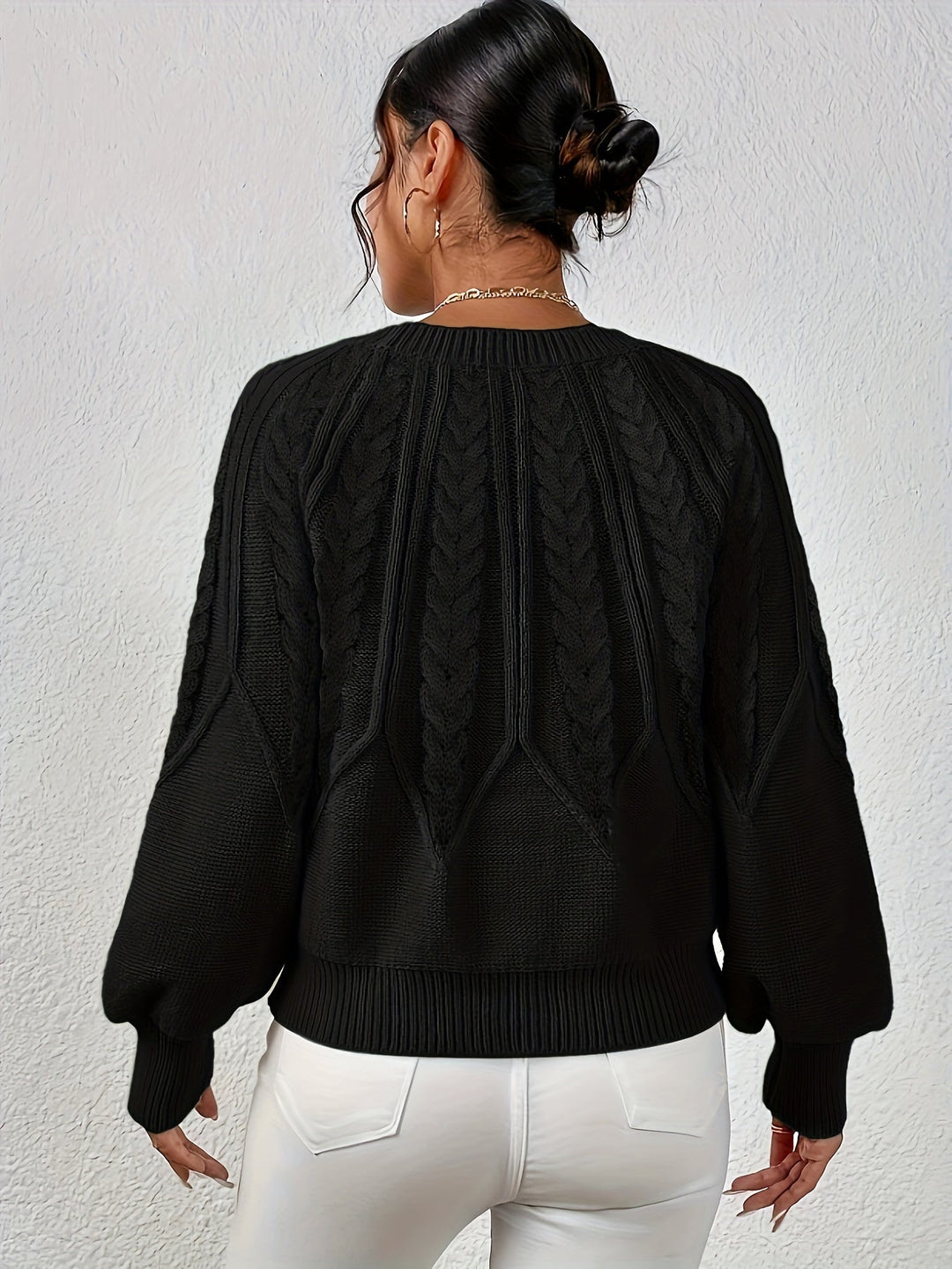 Women's long sleeve relaxed fit cable knit sweater with trendy lantern sleeves.