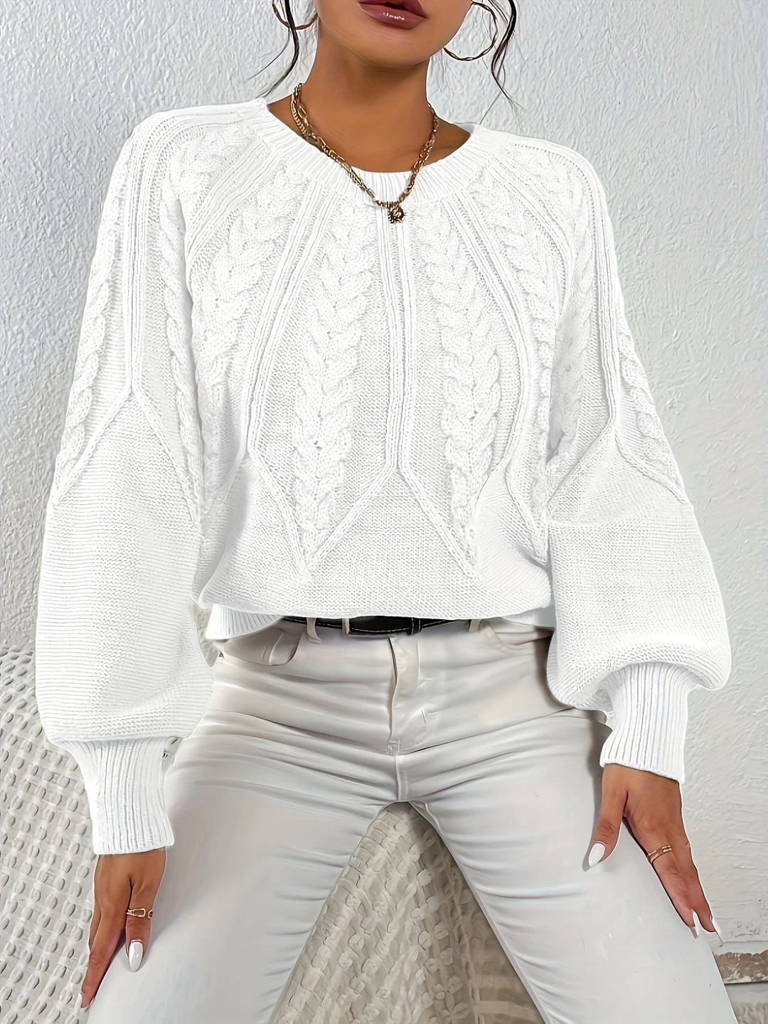 Relaxed fit women's cable knit sweater, cozy and soft, featuring stylish lantern sleeves.