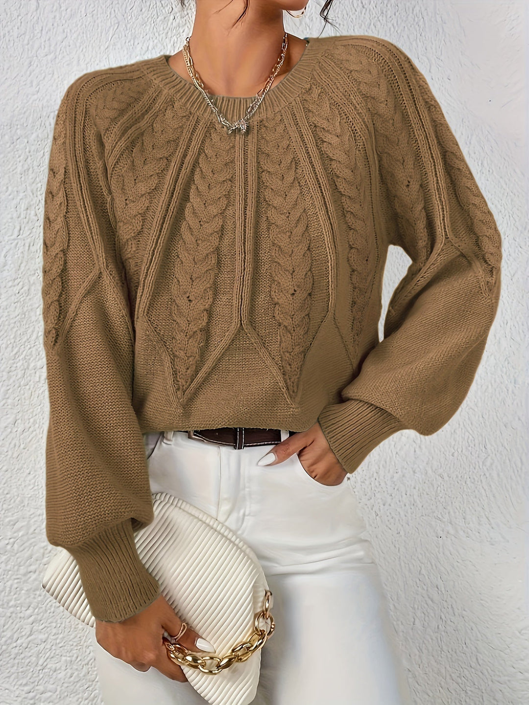 Cozy women's relaxed fit cable knit sweater, ideal for casual outings, with lantern sleeves.