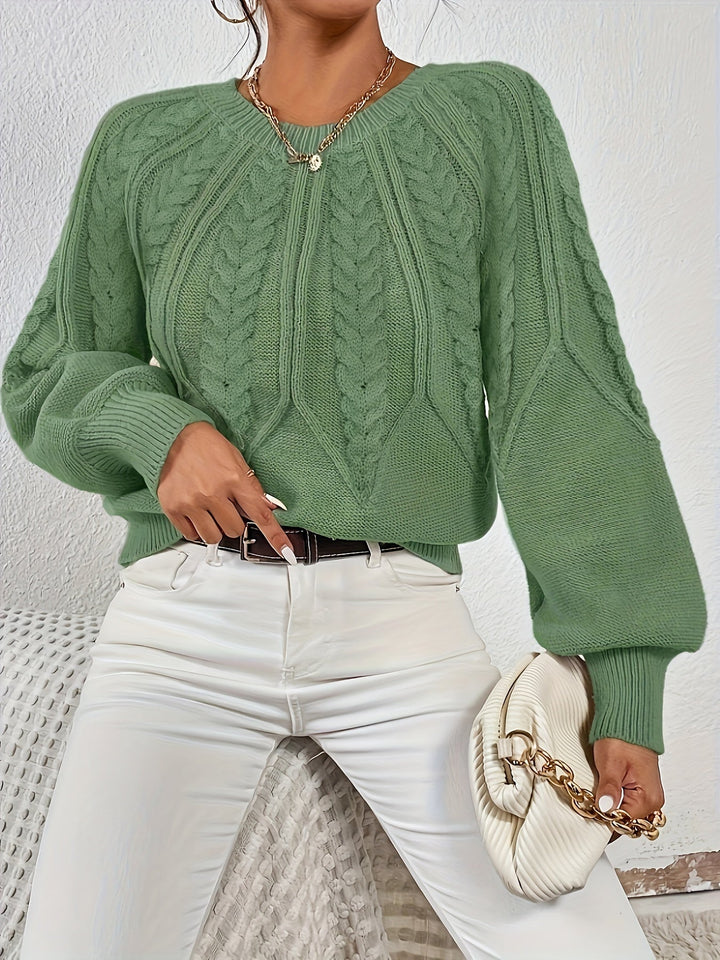 Relaxed fit women's cable knit sweater with charming lantern sleeves; ideal for everyday comfort.
