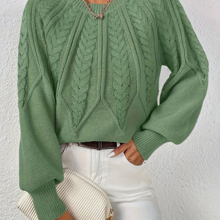Modern women's cable knit sweater, relaxed fit, trendy lantern sleeves, perfect for layering.