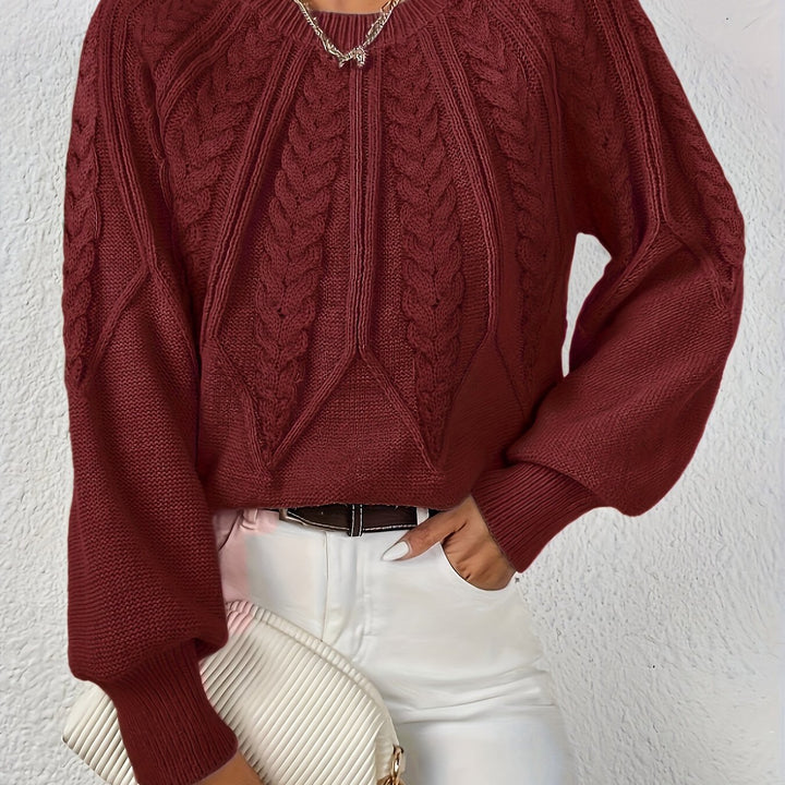 Everyday elegance: women's cable knit sweater, relaxed fit, with graceful lantern sleeves.