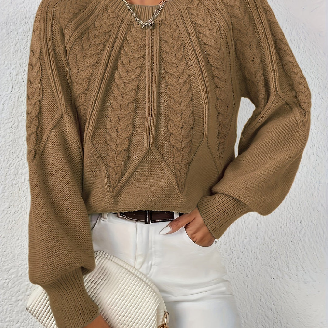 Relaxed fit women's cable knit sweater, cozy for any occasion, with fashionable lantern sleeves.