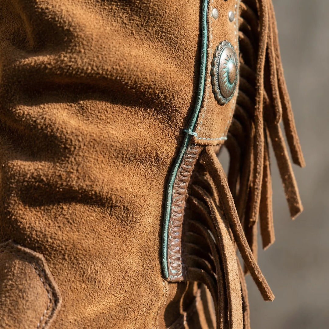 Caroline mid-calf fringe western boots for women. Features block heel, pointed toe, and boho style.