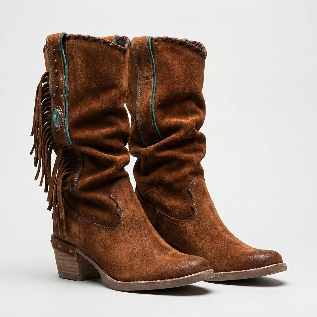 Boho women's mid-calf fringe western boots. Slip-on design, slouchy fit, and comfortable block heel.