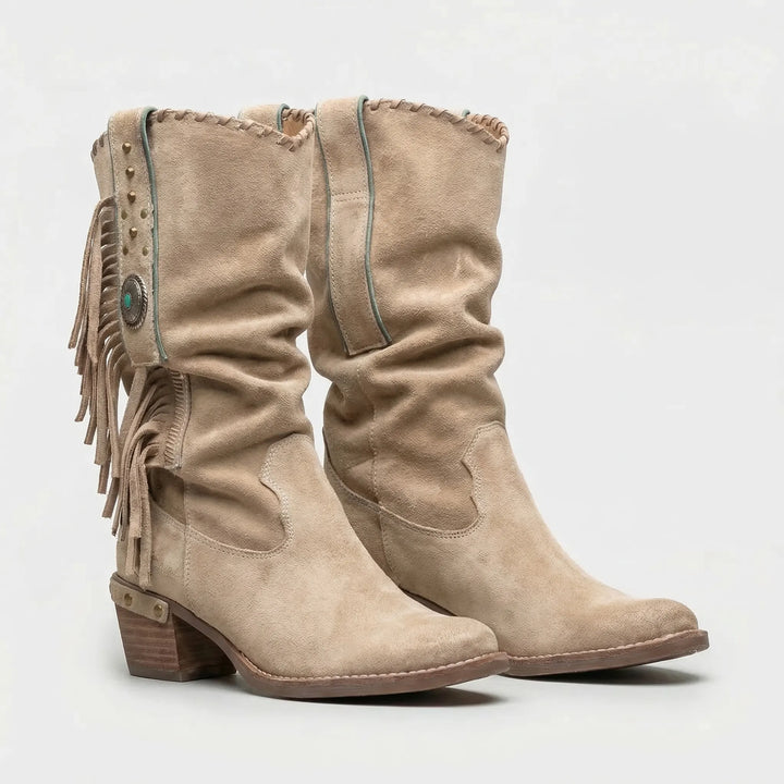 Stylish mid-calf fringe boots for women. Boho western style with a comfortable block heel & pointed toe.