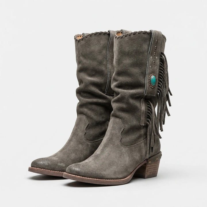 Women's slip-on mid-calf fringe western boots. Caroline design with a block heel for boho fall looks.