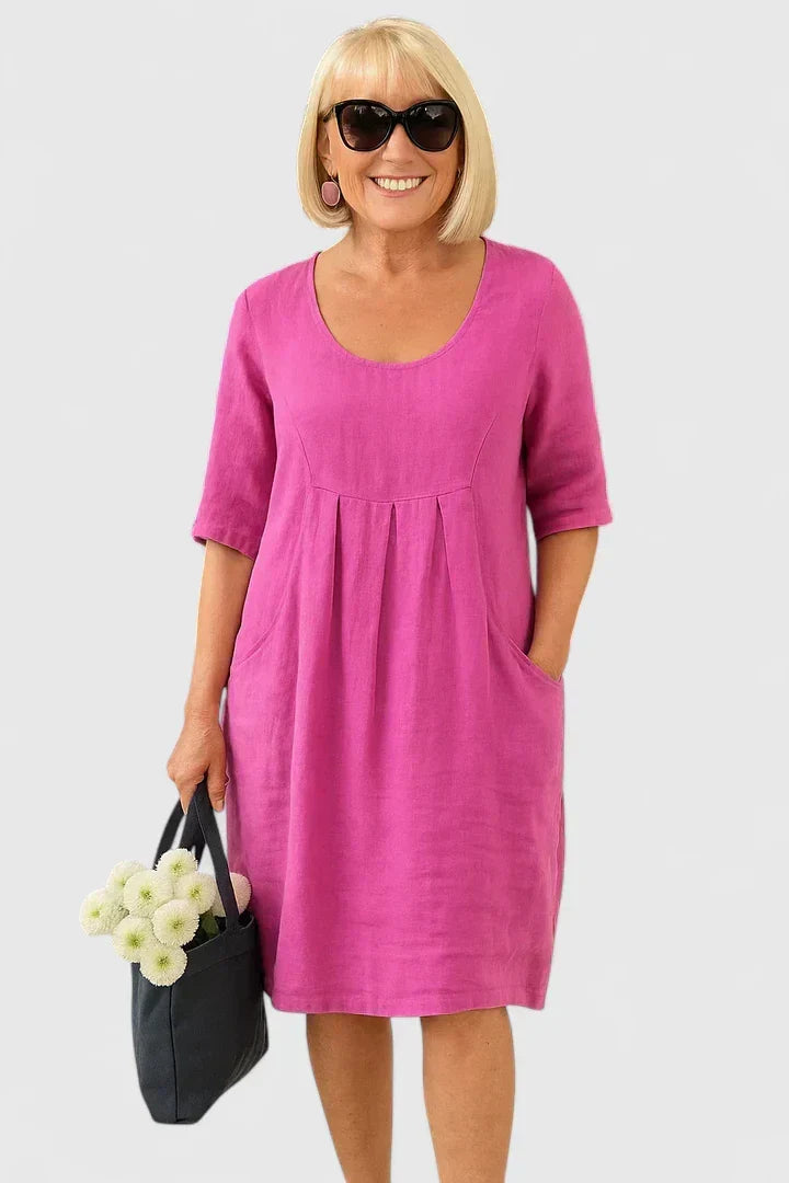 Relaxed fit women's scoop neck midi dress with half sleeves & pockets, versatile for summer casual wear.