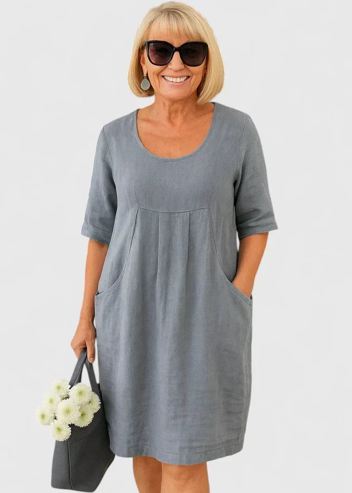 Versatile women's everyday midi dress with an A-line silhouette, comfortable fit, half sleeves, and pockets.