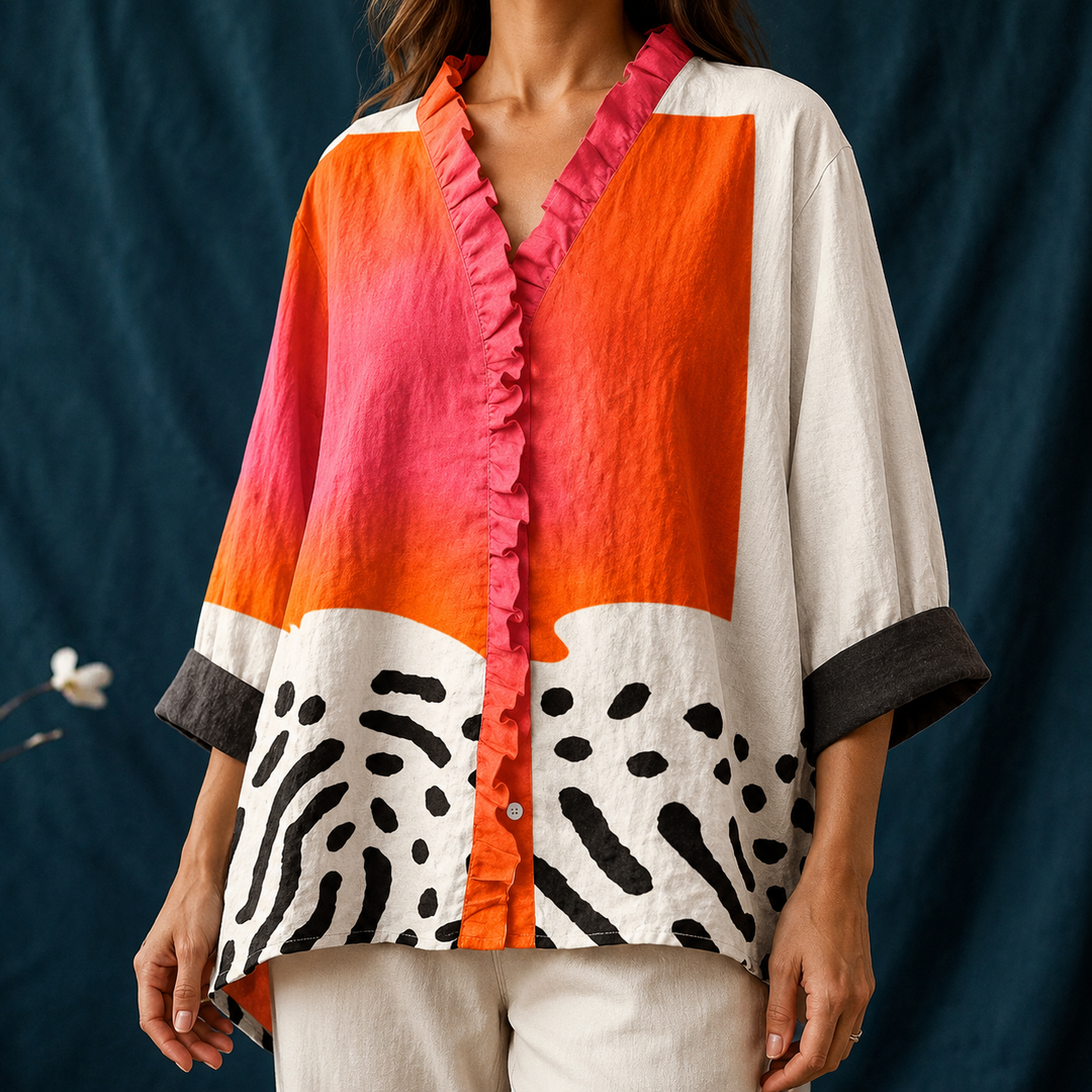 Elegant casual women's blouse featuring a unique abstract print, button-up design, and ruffled V-neck. Versatile long sleeve top.