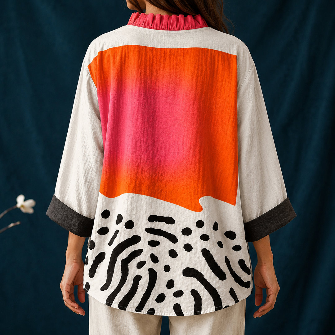 Vibrant abstract print women's blouse. Casual button-up long sleeve top with a chic ruffled V-neck, ideal for summer.