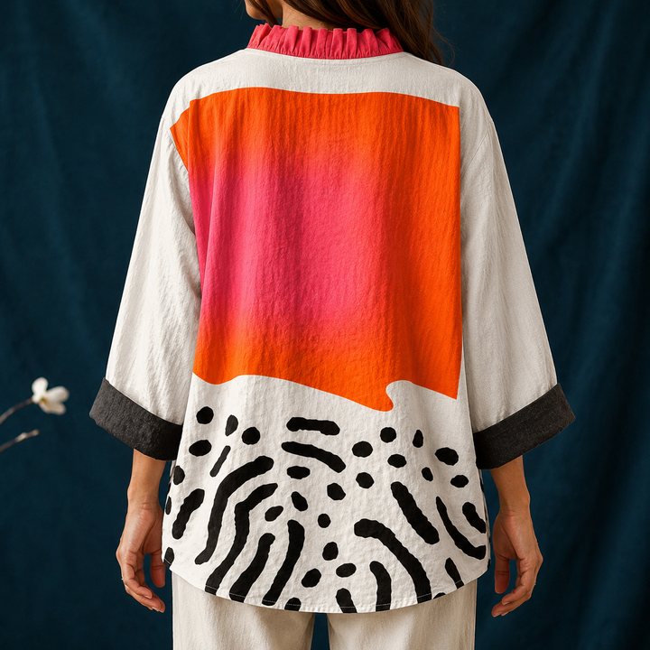 Vibrant abstract print women's blouse. Casual button-up long sleeve top with a chic ruffled V-neck, ideal for summer.