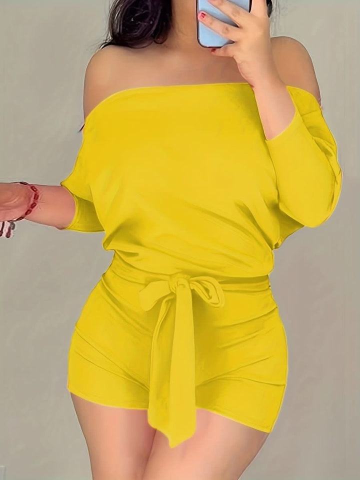 Chic batwing romper shorts for women. Casual, comfortable, and elegant summer jumpsuit style.