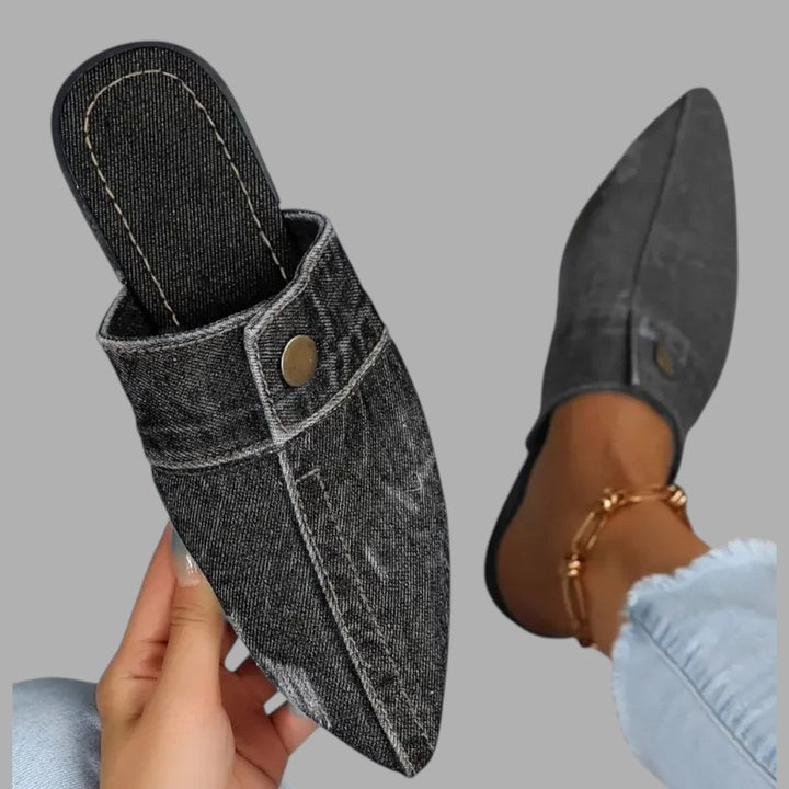 Comfortable women's slip-on mule sandals in a neutral tone, ideal for casual summer outings.