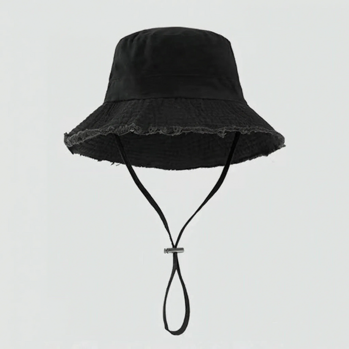 Travel-friendly women's bucket hat, foldable, adjustable strap, for sun protection & casual wear.