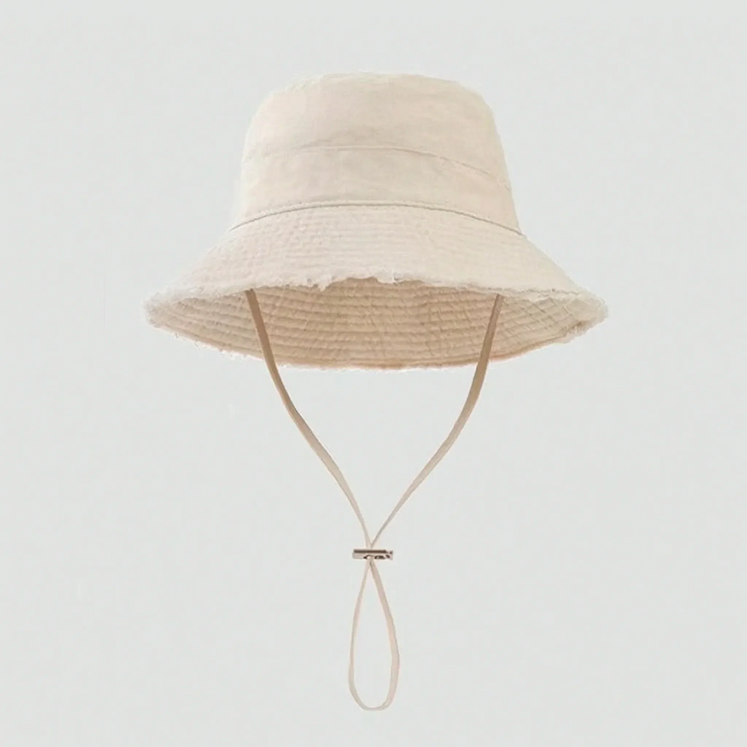 Summer beach bucket hat for women, frayed brim, adjustable strap, offers great sun protection.