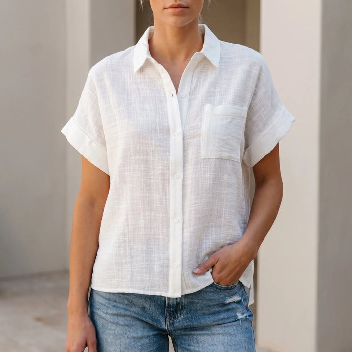 Women's casual button-down shirt with short sleeves, relaxed fit. Perfect lightweight summer top for everyday comfort.