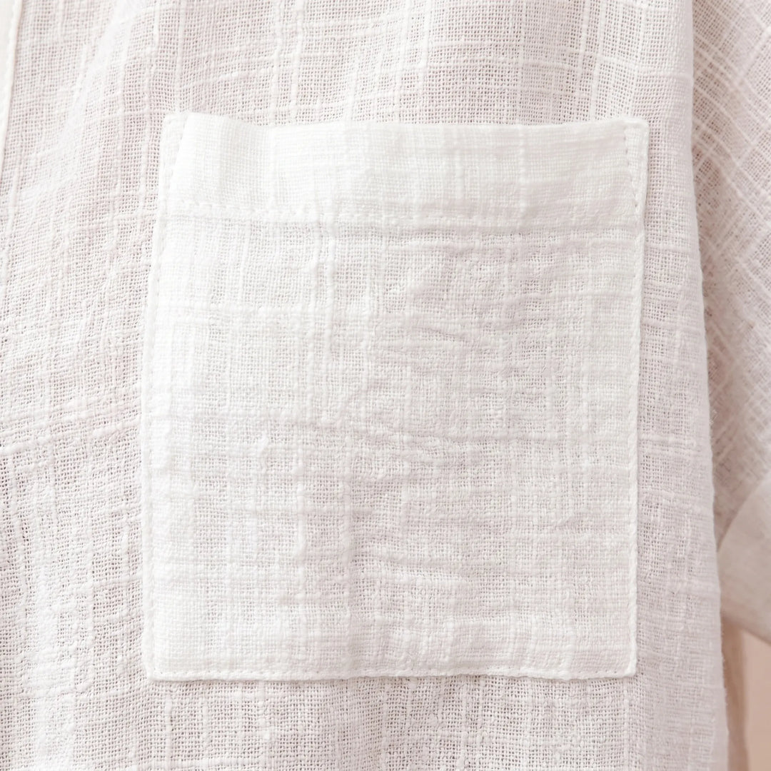 Relaxed fit women's casual button-down shirt. Lightweight short sleeve top for ultimate comfort and easy summer style.