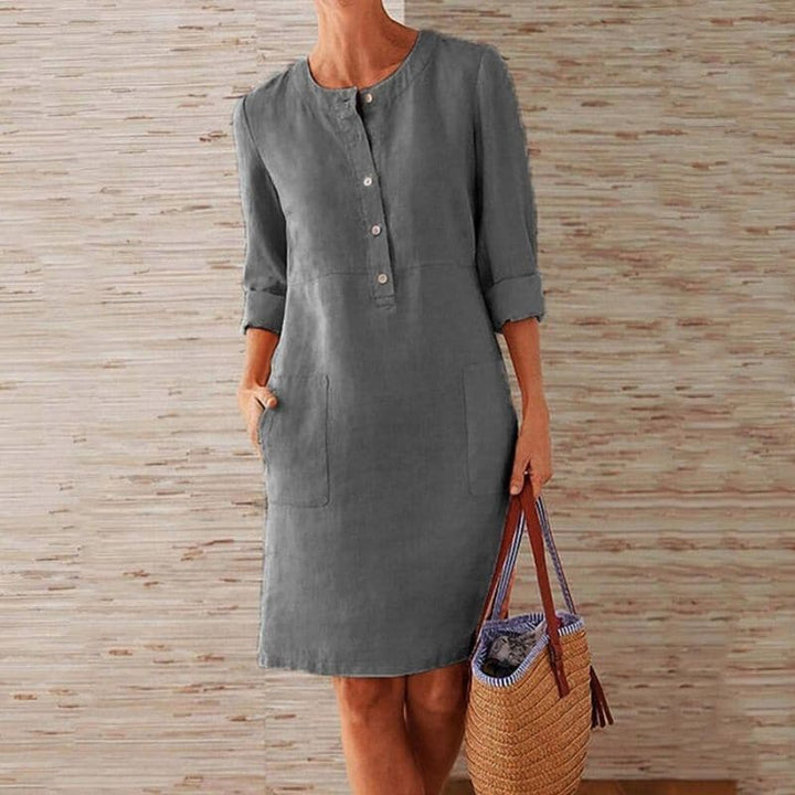 Everyday women's midi shift dress with full button front & side pockets, perfect for casual spring/summer comfort.