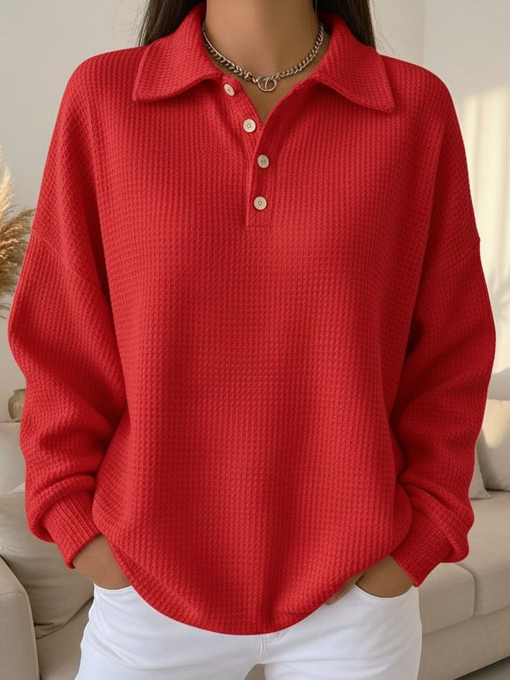Relaxed fit women's Henley pullover with a stylish collar and long sleeves, ideal for comfortable casual wear.