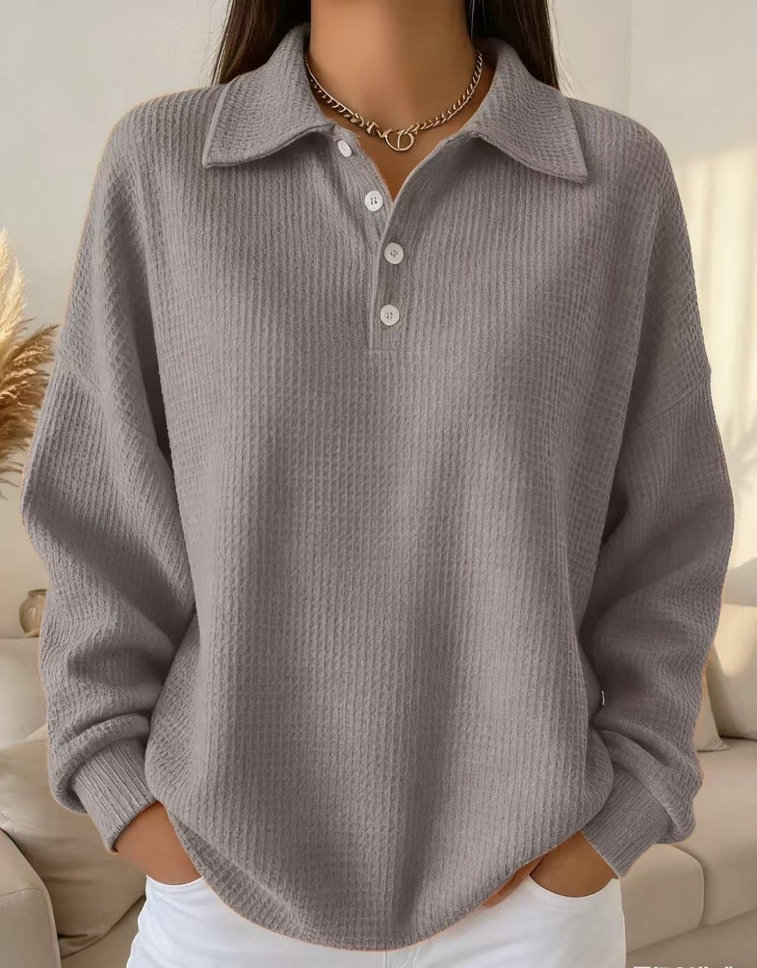 Effortless women's collared Henley sweater, a relaxed fit long-sleeve jumper for stylish autumn casual wear.