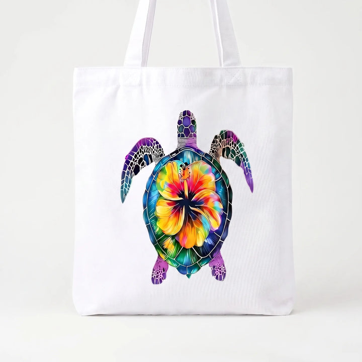 Stylish women's printed tote bag featuring a beautiful hibiscus floral design, ideal for summer beach trips.
