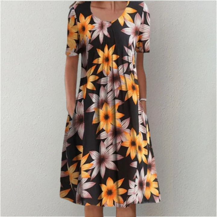 Practical women's casual floral dress with short sleeves & pockets, offering comfort & style for daily wear.