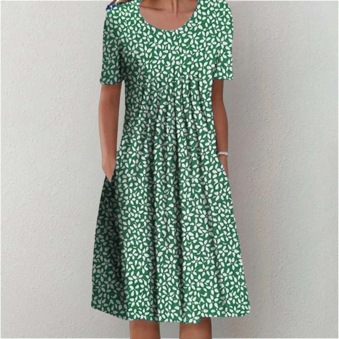 Women's short sleeve floral midi dress with pockets, a comfortable and stylish choice for casual outings.