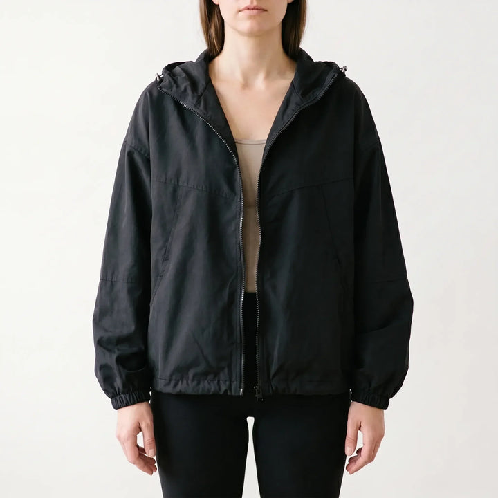 Stylish women's hooded windbreaker jacket in a casual design. Everyday outerwear offering comfort & light protection.