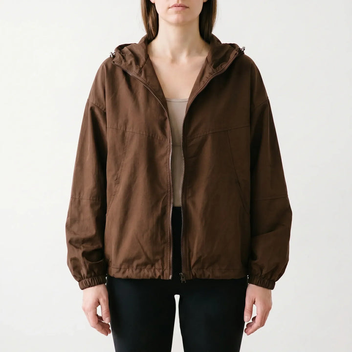 Transitional women's hooded windbreaker jacket for spring & fall. Casual, lightweight outerwear with a practical zipper.
